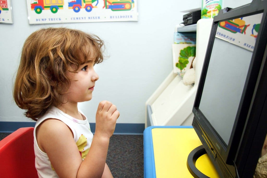 girl looking at computer screen